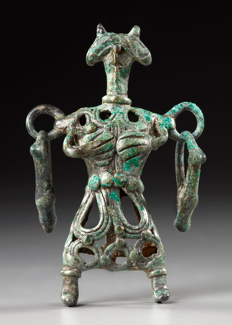 AN AMLASH OPENWORK BRONZE IDOL, CIRCA 1ST MILLENIUM B.C.
