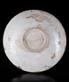 A SLIP-PAINTED POTTERY DISH, PERSIA, 10TH CENTURY