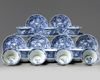 Ten sets of Chinese blue and white foliate rimmed cups and saucers