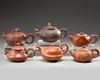 A group of six Chinese medium-sized yixing teapots