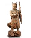 A CHINESE PAINTED AND LACQUERED WOOD FIGURE OF A GUARDIAN, LATE MING DYNASTY (1368-1644)