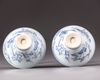A pair of blue and white conical shaped bowls
