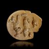 A NEAR EASTERN STAMP SEAL IN THE FORM OF A LION'S HEAD IN YELLOW CALCITE. 3rd. mil.B.C.