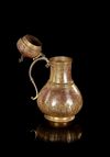 AN OTTOMAN GILT-COPPER (TOMBAK) BOZALIK (BOZA EWER), TURKEY, DATED 1194 AH/1780 AD