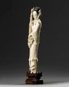A Chinese ivory carving of a lady holding a flower basket