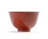 A coral-red glazed bowl