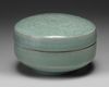 A Korean celadon-glazed ‘chrysanthemum’ round box and cover