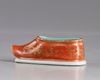 A  gilt Chinese porcelain shoe
