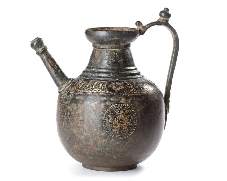 A KHURASAN SILVER-INLAID BRONZE EWER, PERSIA, 12TH CENTURY
