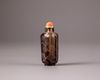 A Chinese smokey-quartz hexagonal inscribed snuff bottle