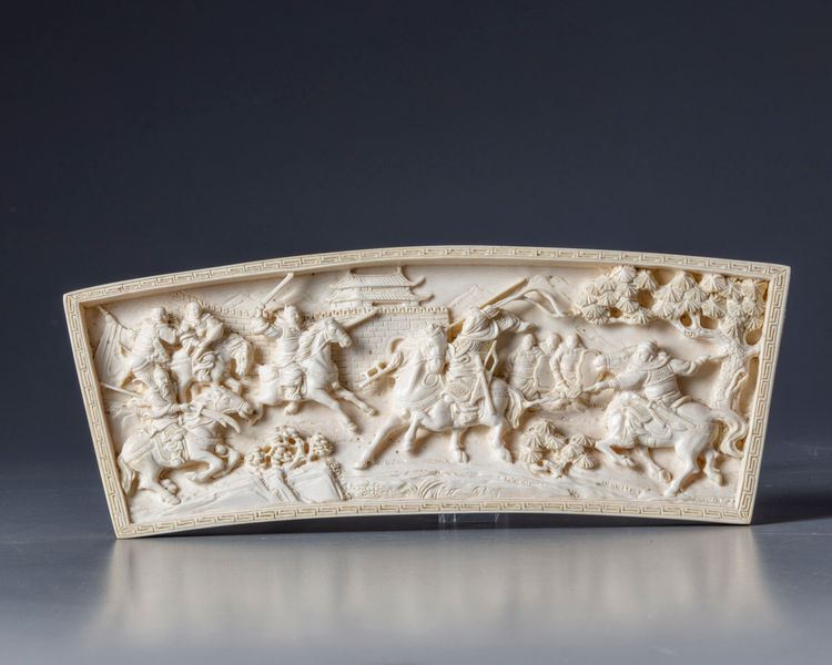 A Chinese ivory plaque depicting a warrior scene