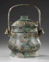 A CHINESE BRONZE RITUAL WINE VESSEL AND COVER, HAN DYNASTY OR LATER