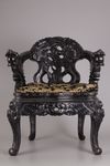 A pair of Chinese hardwood dragon chairs