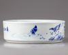 A blue and white porcelain washer