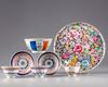 A Chinese famille rose group of three cups, two saucers, a bowl and a dish