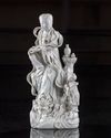 A CHINESE DEHUA GLAZED FIGURE OF GUANYIN AND A BOY, QING DYNASTY (1644-1911)
