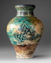 A RAQQA TURQUOISE AND BLACK GLAZED POTTERY VASE, SYRIA 12TH-13TH CENTURY