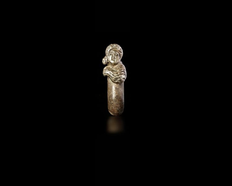 A ROMAN SILVER RING WITH A BUST OF SERAPIS, 1ST CENTURY AD, OR LATER