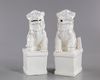 A PAIR OF CHINESE BLANC DE CHINE BUDDHIST LIONS