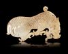A YELLOW JADE TIGER PLAQUE, CHINA, ZHOU - EARLY HAN PERIOD (1046-150 BC)