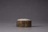 A white jade 'dragon' plaque inset into a gilt filigree box