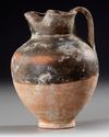 A GREEK OINOCHOE, RED AND BLACK, 3RD - 2ND CENTURY BC