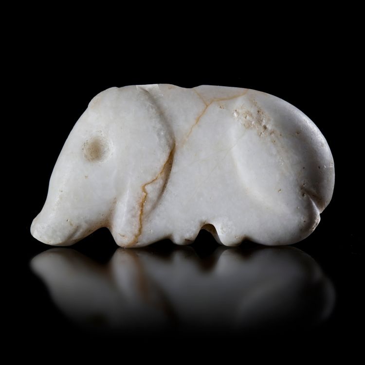 A CALCITE SEAL IN THE SHAPE OF A BOAR, NEAR EASTERN, 3RD MILLENNIUM BC