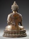 A SINO-TIBETAN BRONZE SEATED BUDDHA,  20TH CENTURY