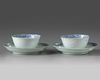 A pair of Chinese bianco sopra bianco-decorated cups and saucers
