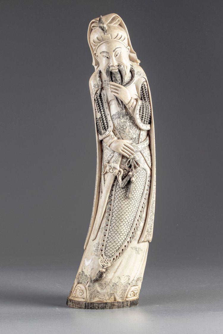 A CHINESE IVORY FIGURE OF GUANDI
