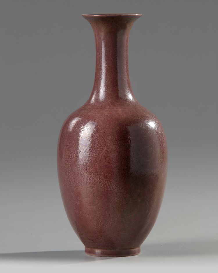 A Chinese aubergine-glazed incised-decorated 'dragon' vase