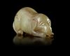 A CHINESE CARVED JADE MYTHICAL BEAST, QING DYNASTY (1644–1911)