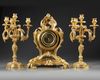 A FRENCH ORMOLU CLOCK SET, 19TH CENTURY