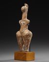 AN AMLASH TERRACOTTA STEATOPHYGOUS FIGURE, CIRCA EARLY 1ST MILLENIUM B.C.