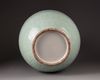 A large Chinese celadon-glazed moulded bottle vase