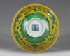 A CHINESE YELLOW-GROUND GREEN-ENAMELLED DRAGON' BOWL, QIANLONG SEAL MARK IN UNDERGLAZE BLUE AND OF THE PERIOD 1736-1795