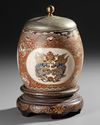 A JAPANESE SATSUMA COVERED JAR WITH WOODEN STAND, 19TH CENTURY