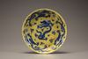 A yellow-ground blue and white 'dragon' dish