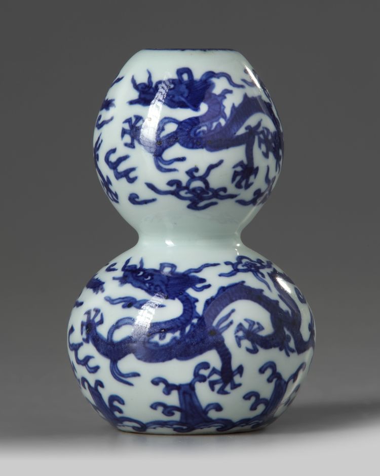 A Chinese blue and white ‘dragons’ double gourd vase