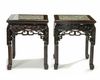 A pair of Chinese hongmu stools inset with a Cantonese famille rose panel