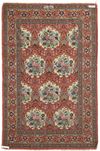 A SIGNED GHOM SILK RUG