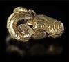 A NEO-ELAMITE GOLD FOIL-COVERED SILVER RAM HEADED AMULET PENDANT, CIRCA 1100-540 B.C.
