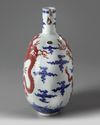 A Chinese underglaze blue and copper-red-decorated 'dragon' moonflask