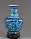 A Chinese gasoline green ground blue and white vase