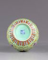 A Chinese famille rose lime green vase