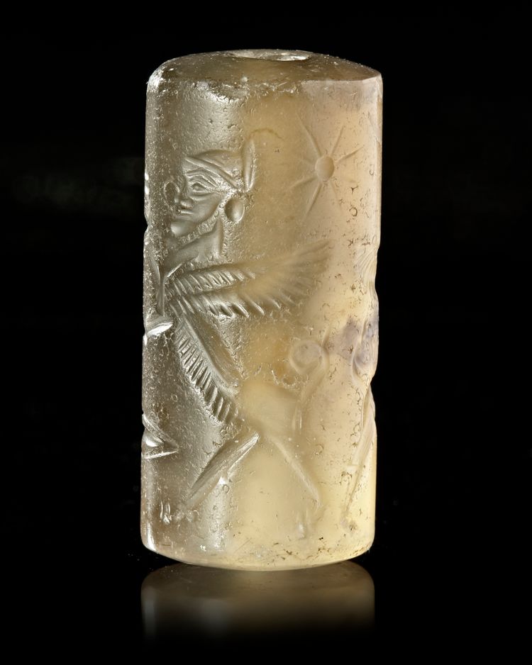A NEO-ASSYRIAN OR NEO-BABYLONIAN CHALCEDONY CYLINDER SEAL, CIRCA 8TH-7TH CENTURY B.C.