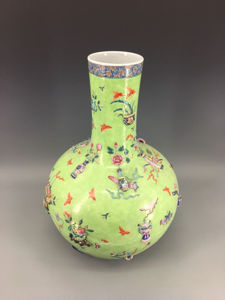 A Chinese green-ground famille rose appliqué decorated bottle vase