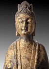 A FINELY CARVED STONE FIGURE OF A STANDING BUDDHIST DEITY