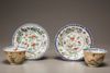 Two pairs of café-au-lait-ground famille verte cups and saucers