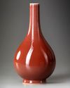 A CHINESE RED-GLAZED PEAR-SHAPED VASE, QIANLONG SEAL MARK IN UNDERGLAZE BLUE